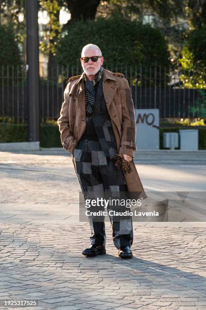Nick Wooster, wearing brown long coat and grey and black suit, is seen during Pitti Immagine Uomo 105 at Fortezza Da Basso on January 11, 2024 in...