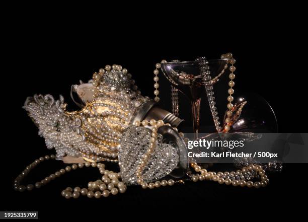 close-up of jewelry against black background,rochester,united kingdom,uk - editorial image stock pictures, royalty-free photos & images