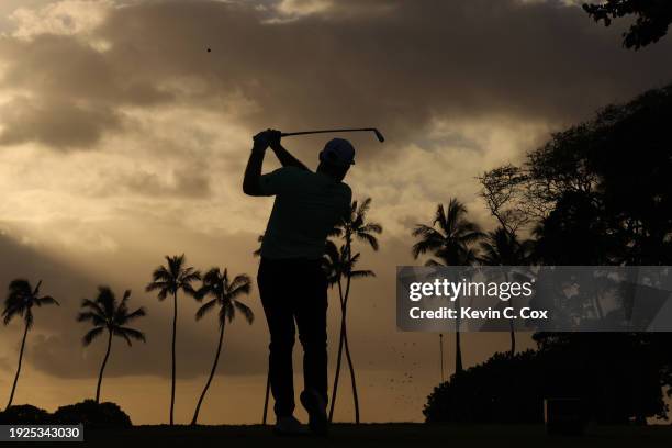 Tyrrell Hatton of England plays his shot from the 11th tee during the first round of the Sony Open in Hawaii at Waialae Country Club on January 11,...