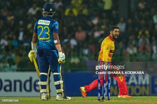 Zimbabwe's Sikandar Raza celebrates after taking the wicket of Sri Lanka's Sadeera Samarawickrama during the first Twenty20 international cricket...
