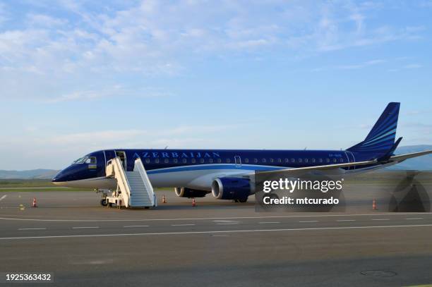 azerbaijan airlines embraer erj-190 regional jet, fuzuli international airport, azerbaijan - azerbaijan stock pictures, royalty-free photos & images