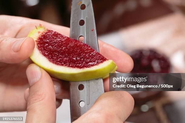 cropped hands cutting watermelon - jello mold stock pictures, royalty-free photos & images