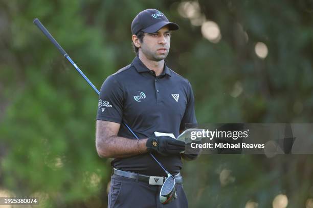Aaron Rai of England lines up a shot on the fifth tee during the first round of the Sony Open in Hawaii at Waialae Country Club on January 11, 2024...