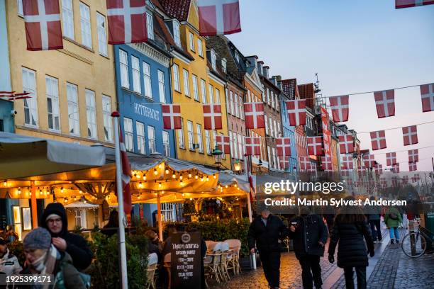 The historic harbour Nyhavn in Copenhagen celebrates the the change of throne with danish flags on January 10, 2024 in Copenhagen, Denmark. On...