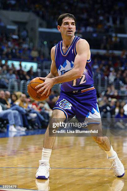 John Stockton of the Utah Jazz looks to pass during the game against the Los Angeles Clippers at Staples Center on April 1, 2003 in Los Angeles,...