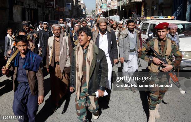 Yemeni protestors loyal to the Houthi movement march as they participate in a protest held against Israel's ongoing war on Gaza and threats of the...