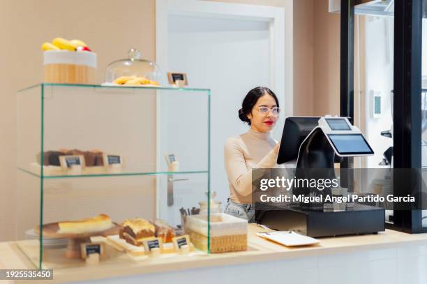 waitress at the checkout in a cafe - cafeteria menu stock pictures, royalty-free photos & images