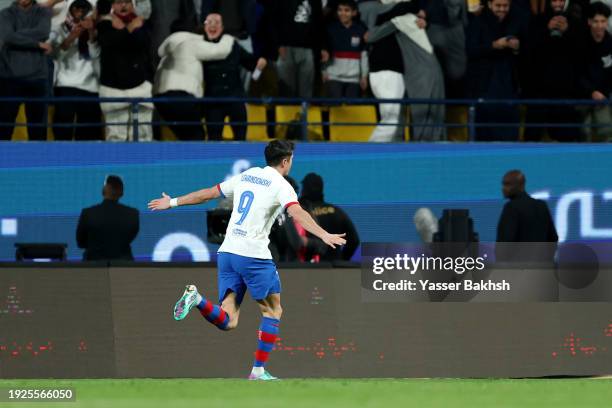 Robert Lewandowski of FC Barcelona celebrates scoring his team's first goal during the Super Copa de Espana Semi-Final match between FC Barcelona and...