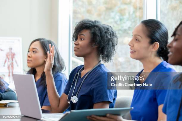 young women attend university class to further nursing or medical education - further stock pictures, royalty-free photos & images
