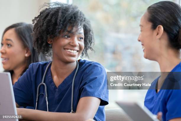 diverse group of medical students take class to further education - further stock pictures, royalty-free photos & images