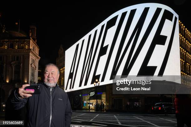 Artist Ai Wei Wei films himself as the first of 81 nightly presentations is displayed on a screen at Piccadilly Circus on January 11, 2024 in London,...