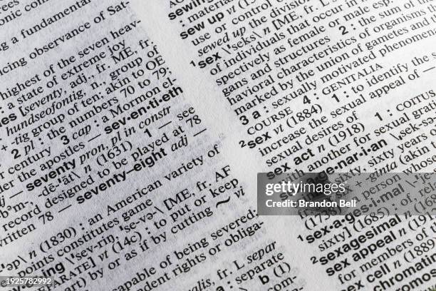 In a photo illustration, definitions are seen opened in a Merriam-Webster's dictionary on January 11, 2024 in Austin, Texas. The Escambia county,...