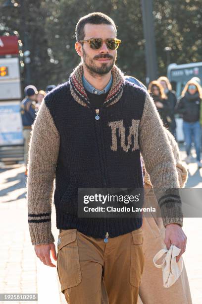 Guest, wearing zipped sweater and brown cargo pants, is seen during Pitti Immagine Uomo 105 at Fortezza Da Basso on January 11, 2024 in Florence,...