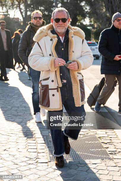 Alessandro Squarzi, wearing shearling coat and denim jacket and pants, is seen during Pitti Immagine Uomo 105 at Fortezza Da Basso on January 11,...