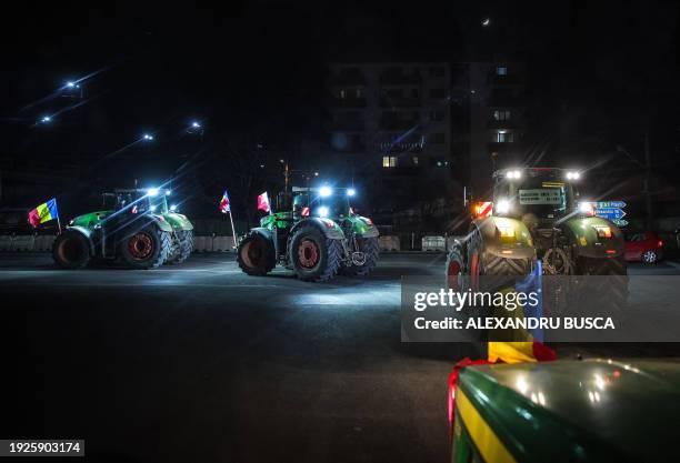 Romanian farmers are stopped on a road in Afumati village, in the outskirts of Bucharest January 14 as Romanian truck drivers and farmers slowed...