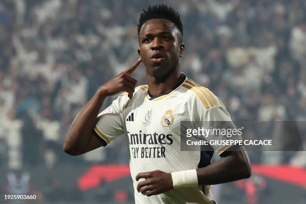 Real Madrid's Brazilian forward Vinicius Junior celebrates after scoring his second goal during the Spanish Super Cup final football match between...