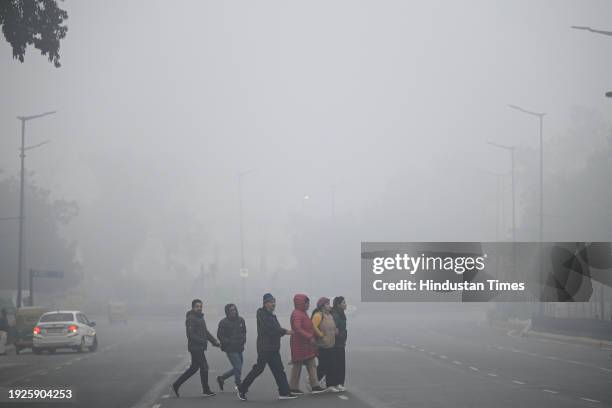 Thick fog blankets engulfed with extreme low visibility near India Gate, during early morning hours, on January 14, 2024 in New Delhi, India. Foggy...