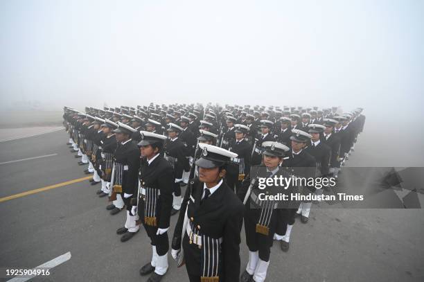 Amid zero visibility thick fog blankets, Indian coast guard personnel rehearse for the upcoming Republic Day parade, at Vijay Chowk, on January 14,...