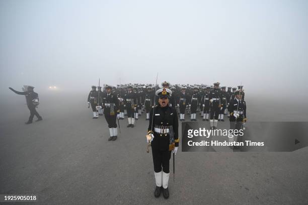 Amid zero visibility thick fog blankets, Indian coast guard personnel rehearse for the upcoming Republic Day parade, at Vijay Chowk, on January 14,...