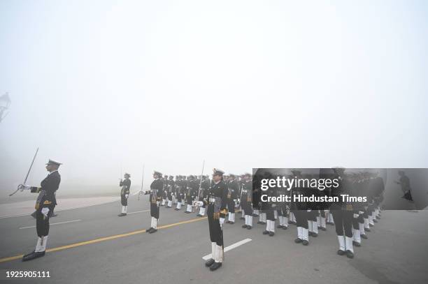 Amid zero visibility thick fog blankets, Indian coast guard personnel rehearse for the upcoming Republic Day parade, at Vijay Chowk, on January 14,...