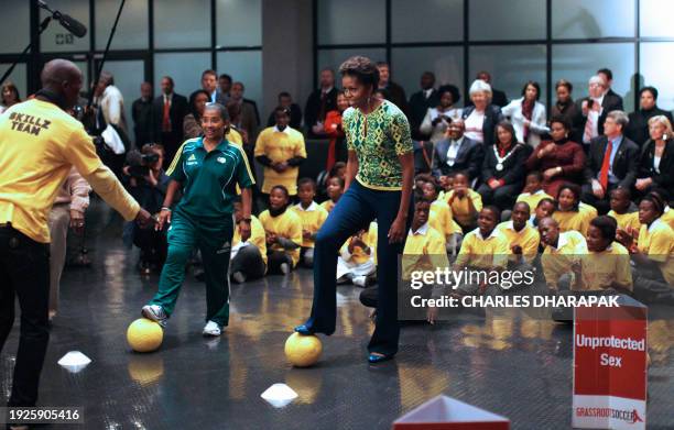 First lady Michelle Obama participates in youth activities raising awareness for HIV prevention at Cape Town Stadium in Cape Town, South Africa on...