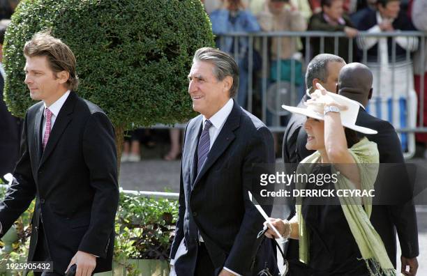 Former head of French employers' federation Medef Ernest-Antoine Seilliere arrives with his wife Antoinette at the Bazas' cathedral to attend the...