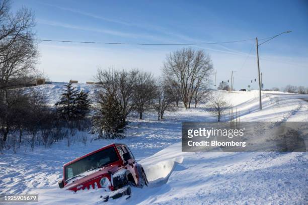 Vehicle off an embankment during a winter storm ahead of the Iowa caucus in West Des Moines, Iowa, US, on Sunday, Jan. 14, 2024. Iowans on Monday...