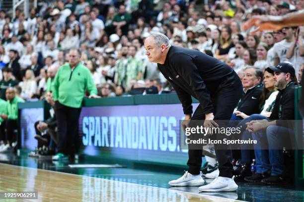 Rutgers Scarlet Knights head coach Steve Pikiell watches the play unfold during a college basketball game between the Michigan State Spartans and the...