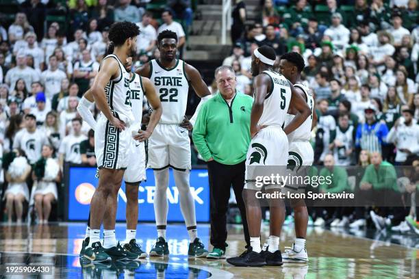 Michigan State Spartans head coach Tom Izzo and his team huddle up during a college basketball game between the Michigan State Spartans and the...