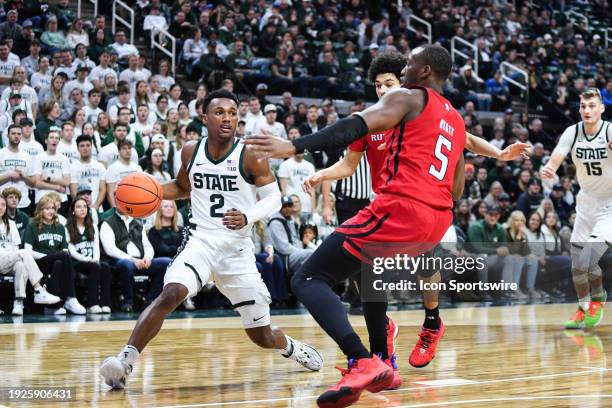 Michigan State Spartans guard Tyson Walker gets his baseline drive cut off during a college basketball game between the Michigan State Spartans and...