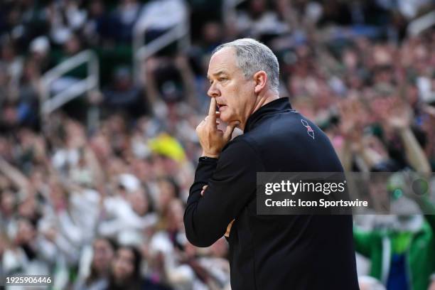 Rutgers Scarlet Knights head coach Steve Pikiell watches the play during a college basketball game between the Michigan State Spartans and the...