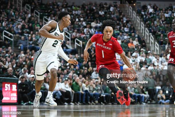 Rutgers Scarlet Knights guard Jamichael Davis knifes into the lane during a college basketball game between the Michigan State Spartans and the...