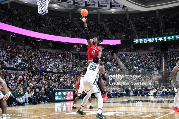 Rutgers Scarlet Knights center Clifford Omuroyi fires up a one-handed hook shot during a college basketball game between the Michigan State Spartans...