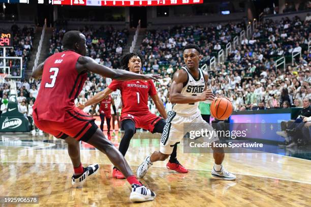 Michigan State Spartans guard Tyson Walker gets trapped in the backcourt during a college basketball game between the Michigan State Spartans and the...