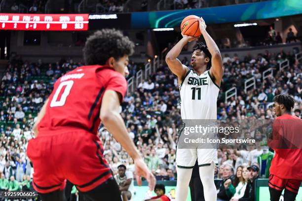 Michigan State Spartans guard A.J. Hoggard fires a three-pointer during a college basketball game between the Michigan State Spartans and the Rutgers...