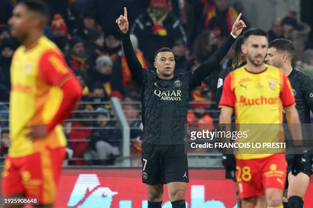 Paris Saint-Germain's French forward Kylian Mbappe celebrates scoring his team's second goal during the French L1 football match between RC Lens and...