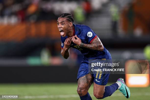 Cape Verde's forward Garry Rodrigues takes off his jersey as he celebrates scoring his team's second goal during the Africa Cup of Nations 2024 group...