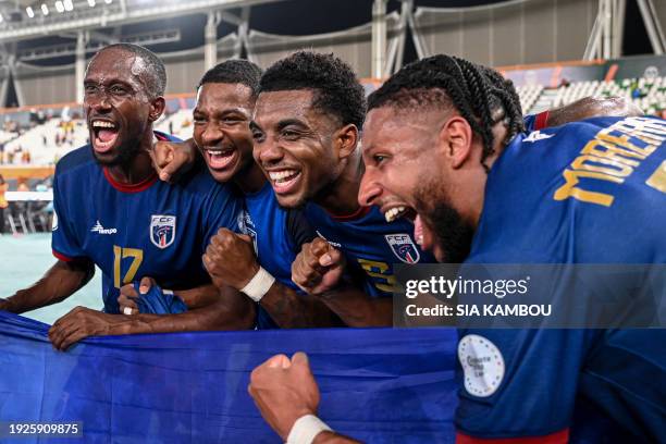 Cape Verde's players celebrate after winning at the end of the Africa Cup of Nations 2024 group B football match between Ghana and Cape Verde at the...