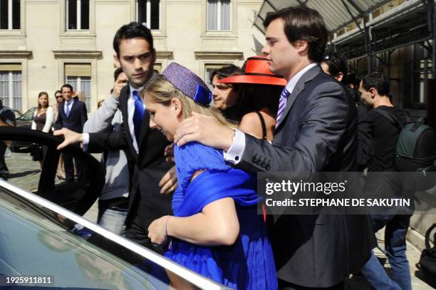 Jeanne-Marie Martin , smiles while surrounded by a friend and new-wed husband Gurvan Rallon , leaves on May 10, 2008 the city hall of Paris's VIIth...