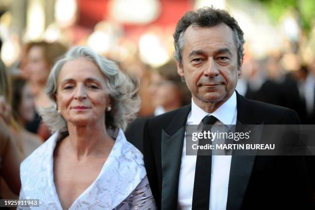 French TV host Michel Denisot arrives with his wife Martine Patier for the screening of the movie "Coco Chanel & Igor Stravinsky" by French director...