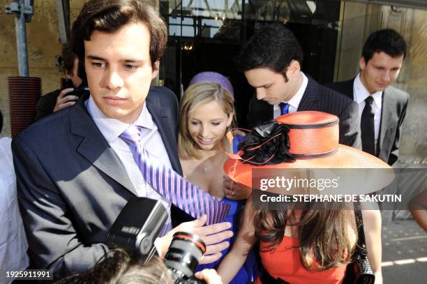 Jeanne-Marie Martin , smiles, surrounded by a friend and new-wed husband Gurvan Rallon , as she leaves on May 10, 2008 the city hall of Paris's VIIth...