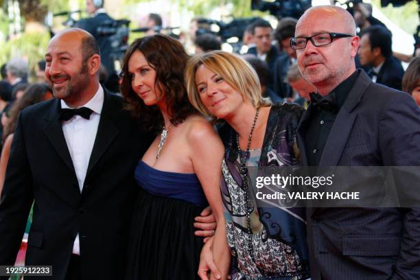 French actors Kad Merad and Olivier Baroux arrive with their wives, Emmanuelle Cosso and Coralie, for the screening of the movie "Vengeance" in...