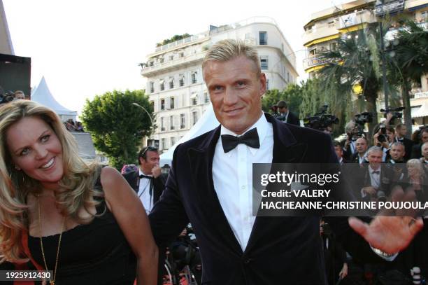 Swedish actor Dolph Lundgren gestures 24 May 2007 upon arriving with his wife Anette Qviberg at the Festival Palace in Cannes, southern France, for...