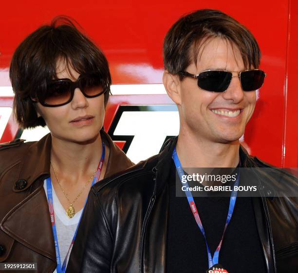 Actor Tom Cruise and his wife Katie Holmes look at Australian MotoGP rider Casey Stoner's Ducati before the Red Bull US Grand Prix in Laguna Seca,...