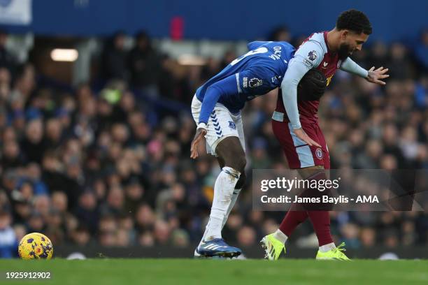 Douglas Luiz of Aston Villa clashes with Amadou Onana of Everton during the Premier League match between Everton FC and Aston Villa at Goodison Park...