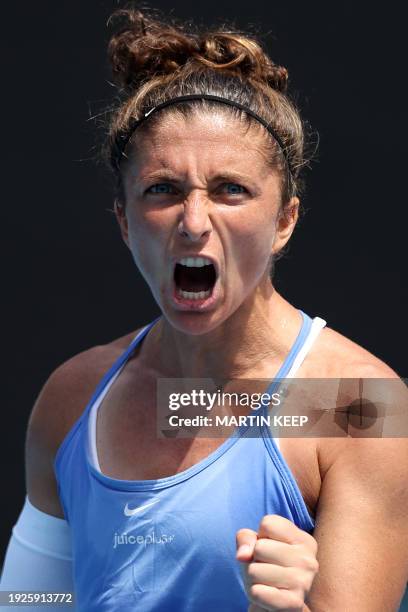 Italy' Sara Errani reacts on a point against Australia's Storm Hunter during their women's singles match on day two of the Australian Open tennis...
