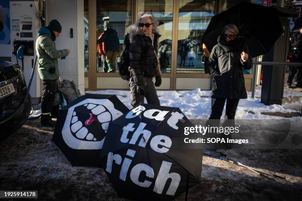 Protesters march on street during a rally against the 54th World Economic Forum. Hundreds of protesters gathered to voice concerns about this year's...