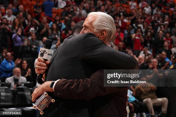 Legends Dwyane Wade and Pat Riley embrace during halftime between the Charlotte Hornets and the Miami Heat on January 14, 2024 at Kaseya Center in...