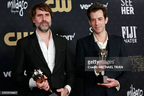 British producer Mark Ronson and US musician Andrew Wyatt pose in the press room with the Best Song award for "I'm Just Ken" from the movie "Barbie"...