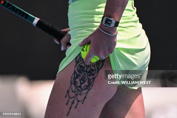 Tattoo on the leg of Ukraine's Elina Svitolina as she prepares to serve against Australia's Taylah Preston during their women's singles match on day...